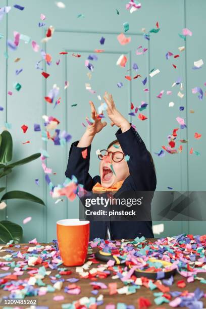 2-3 years old child wearing a suit like a businessman and he work in his office table. he celebrating his success. - kid making money stock pictures, royalty-free photos & images