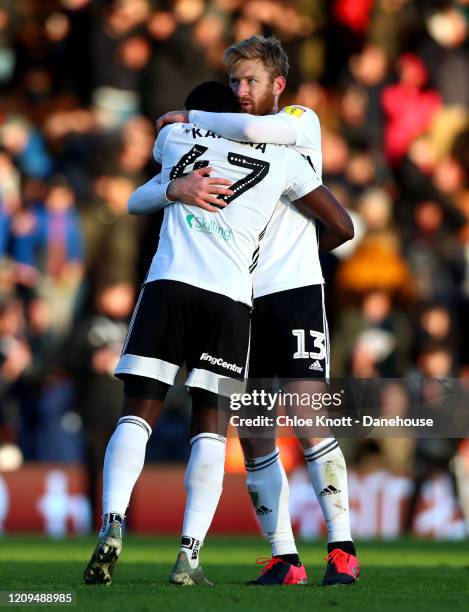 Tim Ream and Aboubakar Kamara of Fulham FC hug after during the Sky Bet Championship match between Fulham and Preston North End at Craven Cottage on...