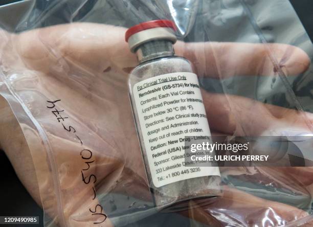 One vial of the drug Remdesivir lies during a press conference about the start of a study with the Ebola drug Remdesivir in particularly severely ill...