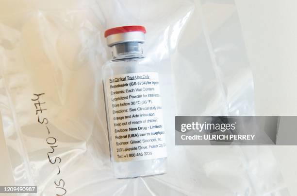 One vial of the drug Remdesivir lies during a press conference about the start of a study with the Ebola drug Remdesivir in particularly severely ill...