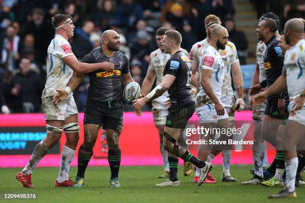 Paul Lasike of Harlequins celebrates scoring a try with Tom Penny during the Gallagher Premiership Rugby match between Harlequins and Exeter Chiefs...