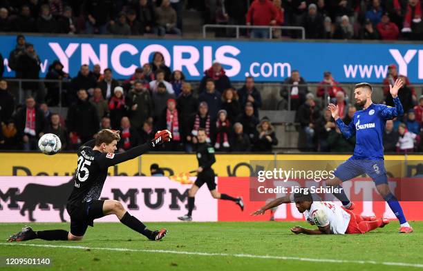 Jhon Cordoba of 1. FC Koeln scores his team's second goal past Alexander Nuebel of FC Schalke 04 04during the Bundesliga match between 1. FC Koeln...