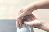 Hand pushing or pumping algohol gel for wash / cleaning hands from virus, bacteria, for good hygiene