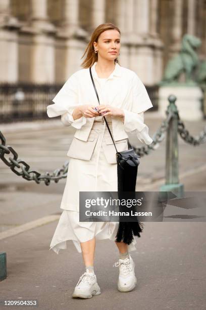 Julia Kuczynska wearing white blouse, white midi skirt, Balenciaga sneakers outside Vivienne Westwood show during Paris Fashion week Womenswear...