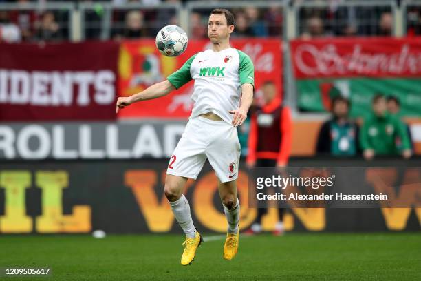 Stephan Lichtsteiner of Augsburg runs with the ball during the Bundesliga match between FC Augsburg and Borussia Moenchengladbach at WWK-Arena on...