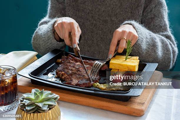 woman eating lunch - red meat stock pictures, royalty-free photos & images