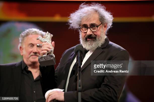 Benoit Delepine and Gustave Kervern, winner of the Silver Bear 70th Berlinale for the film "Delete History" are seen on stage at the closing ceremony...