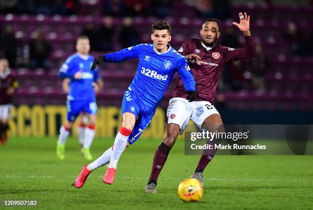 Ianis Hagi of Rangers looks to break past Loïc Damour of Hearts during the Scottish Cup Quarter Final match between Hearts and Rangers at Tynecastle...