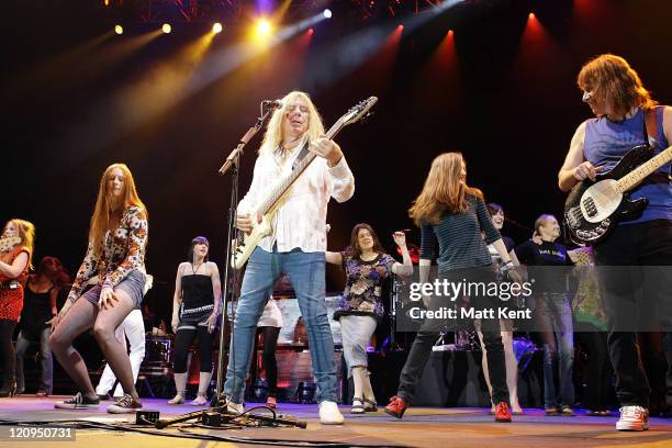 Michael McKean performs as David St Hubbins and Christopher Guest performs as Nigel Tufnel of Spinal Tap at their 'One Night World Tour' at Wembley...