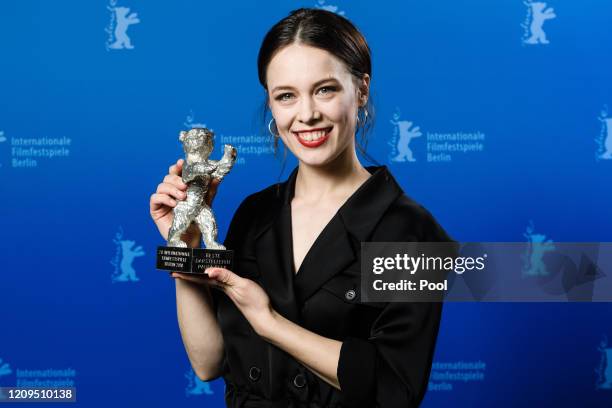 Paula Beer poses with the Silver Bear for Best Actress for the film "Undine" after the award ceremony of the 70th Berlinale International Film...