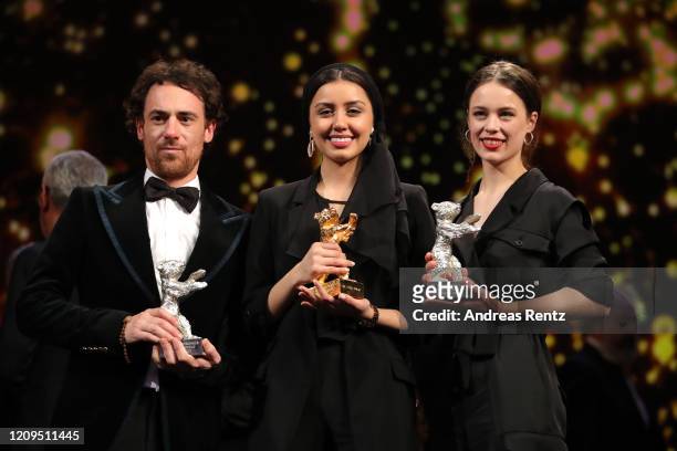 Elio Germano, winner of the Silver Bear for Best Actor for the film "Hidden Away", Baran Rasoulof with the Golden Bear for Best Film for the film...
