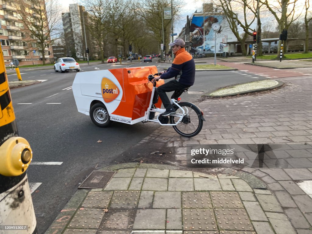 Postman on cargo bike