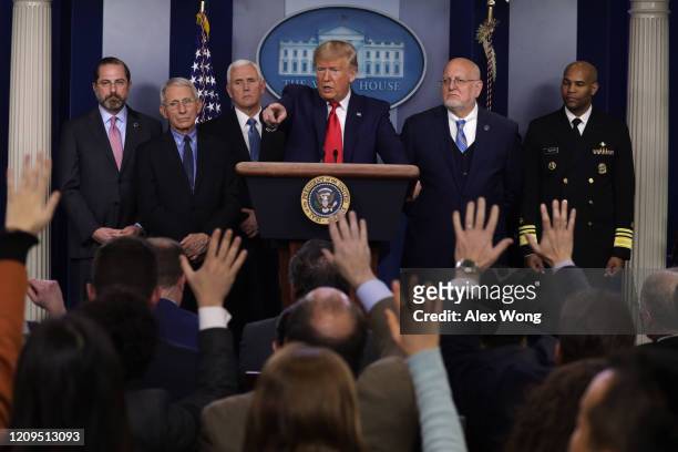 President Donald Trump takes questions as Health and Human Services Secretary Alex Azar, National Institute for Allergy and Infectious Diseases...