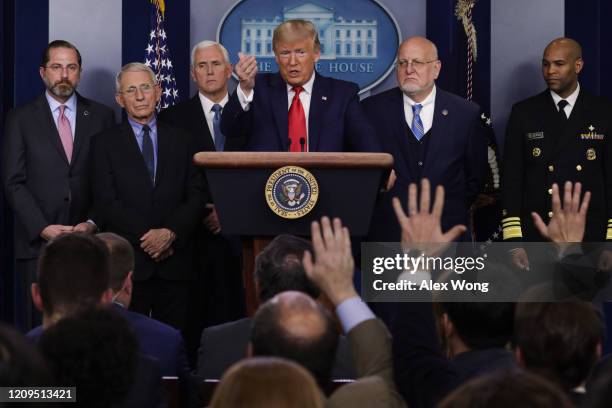 President Donald Trump speaks as Health and Human Services Secretary Alex Azar, National Institute for Allergy and Infectious Diseases Director...