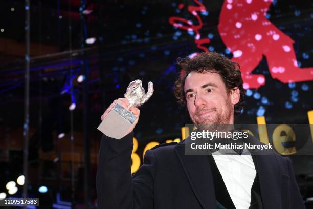 Elio Germano, winner of the Silver Bear for Best Actor for the film "Hidden Away" poses after the closing ceremony of the 70th Berlinale...