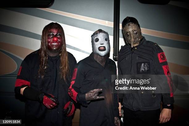 Slipknot's Shawn Crahan, Corey Taylor and Chris Fehn pose backstage at Cypress Hill's Smokeout on October 24, 2009 in San Bernardino, California.