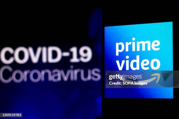 In this photo illustration the Amazon Prime Video logo seen displayed on a smartphone with a computer model of the COVID-19 coronavirus in the...