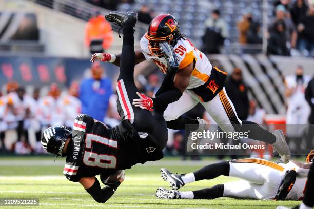 Jake Powell of the NY Guardians is tackled by Gause Quentin of the LA Wildcats during the first half of their XFL game at MetLife Stadium on February...