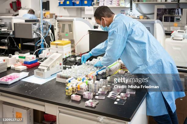 Histowiz lab scientists preparing to test COVID-19 samples from recovered patients on April 8, 2020 in Brooklyn, New York City. New York City is the...