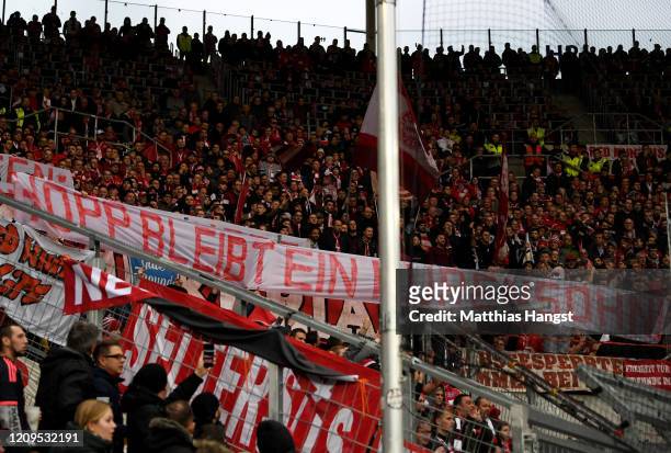 Fans of FC Bayern Muenchen show a banner against Dietmar Hopp during the Bundesliga match between TSG 1899 Hoffenheim and FC Bayern Muenchen at...