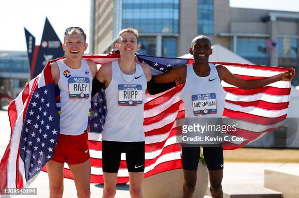 Jacob Riley, Galen Rupp, and Abdi Abdirahman pose together after finishing in the top three of the Men's U.S. Olympic marathon team trials on...