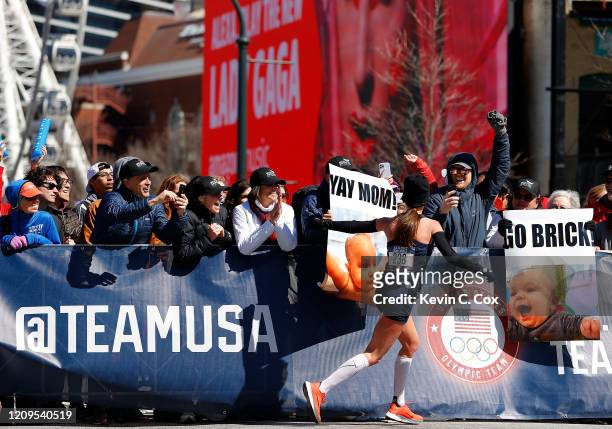 Brooke Slayman acknowledges fans as she makes the eight mile turn during the Women's U.S. Olympic marathon team trials on February 29, 2020 in...