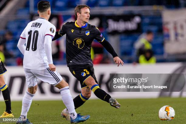 Mike Jensen of Apoel passes the ball during the UEFA Europa League round of 32 second leg match between FC Basel and APOEL Nikosia at St. Jakob-Park...