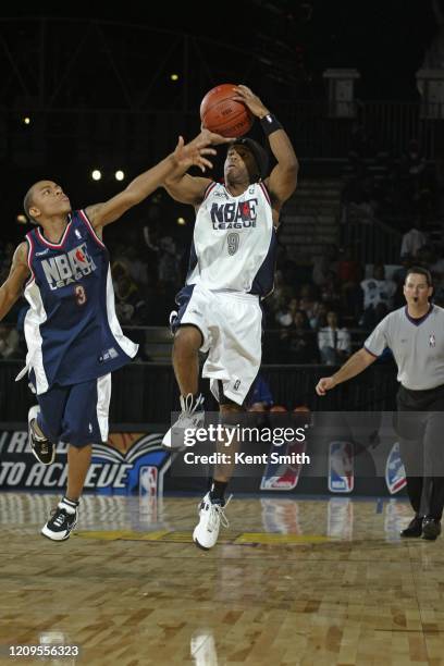 Larenz Tate of the West Team shoots the ball against Bow Wow of the East Team during the NBAE celebrity game at Jam Session as part of 2004 NBA All...