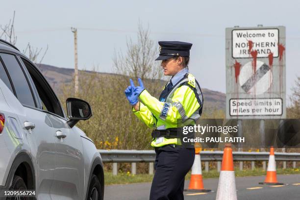 Irish Police stop and check vechicles at the border crossing at Carrkcarnon, County Louth, Ireland, on April 9, 2020 under new powers to curb...