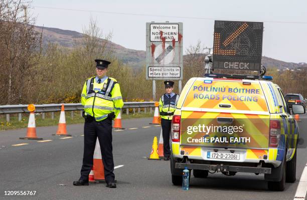 Irish Police stop and check vechicles at the border crossing at Carrkcarnon, County Louth, Ireland, on April 9, 2020 under new powers to curb...