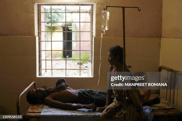 An Indian patient is treated for suspected cholera in a hospital in Kakiriguma village of Koraput district, some 500 kilometres southwest of Orissa...