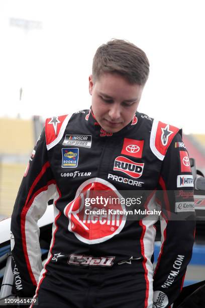 Christopher Bell, driver of the Rheem Toyota, stands by his car before qualifying for the NASCAR Cup Series Auto Club 400 at Auto Club Speedway on...