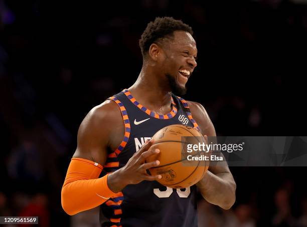 Julius Randle of the New York Knicks smiles as he runs out the clock in the final minute of the game against the Chicago Bulls at Madison Square...
