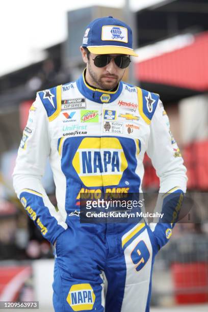 Chase Elliott, driver of the NAPA Auto Parts Chevrolet, walks on the grid before qualifying for the NASCAR Cup Series Auto Club 400 at Auto Club...