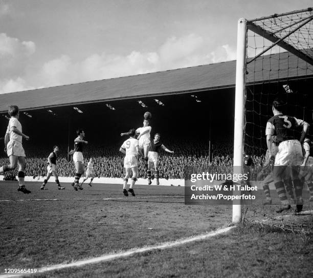 Freddie Goodwin of Manchester United rises highest to head the ball during the Football League Division One match between Burnley and Manchester...
