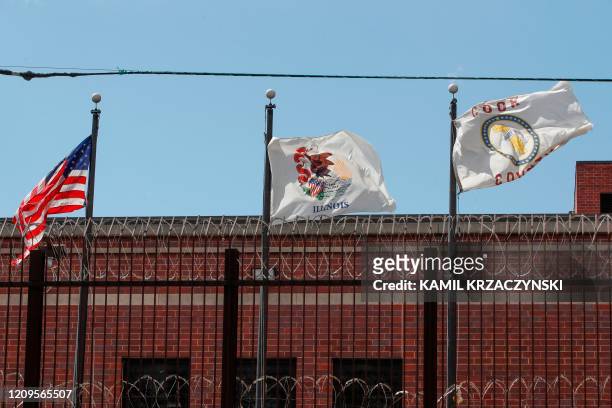 Flags fly above barbed wire at the Cook County Department of Corrections , housing one of the nation's largest jails, is seen in Chicago, Illinois,...