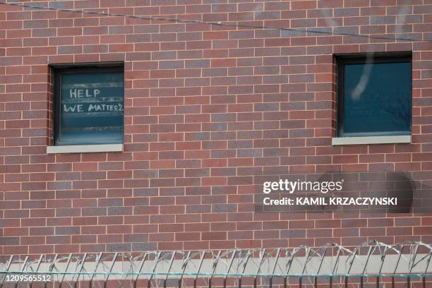 The words "help we matter 2" are seen written in a window at the Cook County Department of Corrections , housing one of the nation's largest jails,...