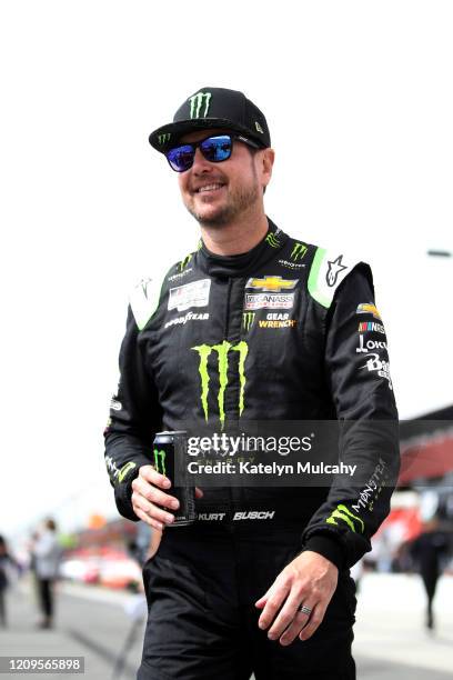 Kurt Busch, driver of the Monster Energy Chevrolet, walks on the grid before qualifying for the NASCAR Cup Series Auto Club 400 at Auto Club Speedway...