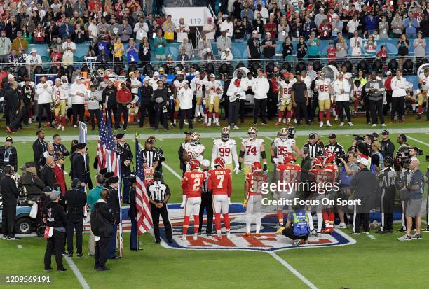 The San Francisco 49ers captains and Kansas City Chiefs captains stand together at the 50 yard line for the coin toss prior to the start of Super...