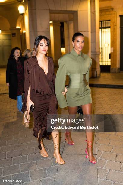 Amina Muaddi and Tina Kunakey are seen, outside the MyTheresa x Amina Muaddi dinner at Froufrou Place Edouard VII, during Paris Fashion Week -...