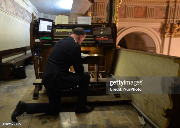 Tyniec Benedictine Monastry's organist seen during the Holy Thursday mass, marking the start of the Christian three-day celebration of Easter. On...