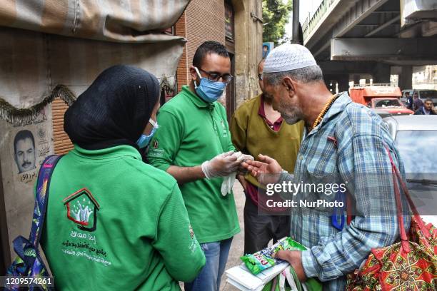 Man sprays disinfectant of the homeless, and this came as part of the &quot;We Are With You&quot; intimate to limit the spread of coronavirus , in a...