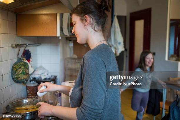 Turin, Italy 10 March 2020. Luisa, a high school student, tries to prepare a cake during the quarantine after the school closes following government...
