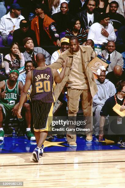 Fred Jones and Jermaine O'Neal of the Indiana Pacers high five during the Dunk Contest at All Star Saturday Night as part of 2004 NBA All Star...