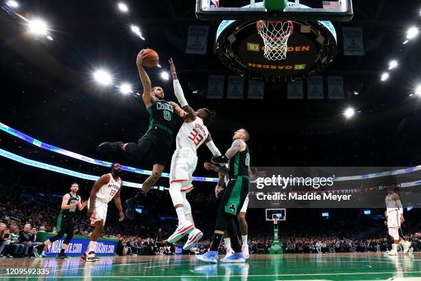 Jayson Tatum of the Boston Celtics takes a shot over Robert Covington of the Houston Rockets during the game at TD Garden on February 29, 2020 in...