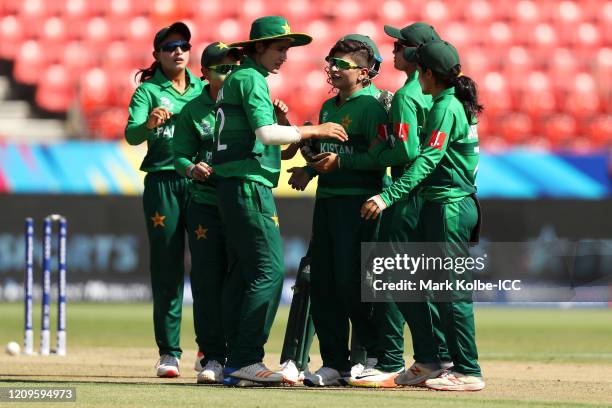 Nida Dar of Pakistan celebrates with her team mates after taking the wicket of Mignon du Preez of South Africa during the ICC Women's T20 Cricket...