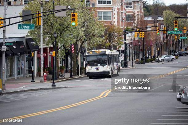 Bus drives down West Palisade Avenue in Englewood, New Jersey, U.S., on Friday, April 10, 2020. Huge daily infection spikes are slowing in Bergen...