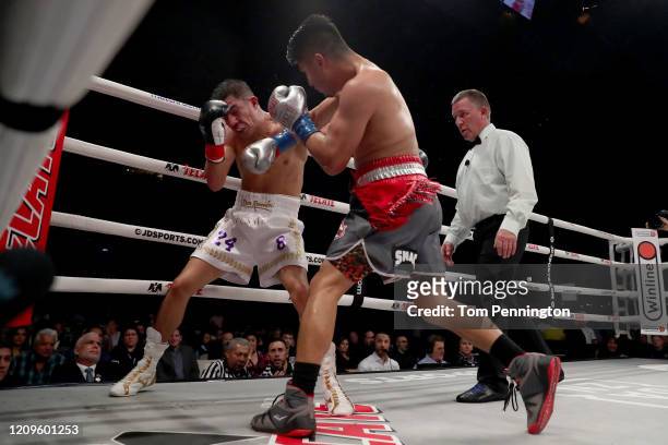 Mikey Garcia punches Jessie Vargas in their WBC Welterweight Diamond Championship bout at The Ford Center at The Star on February 29, 2020 in Frisco,...