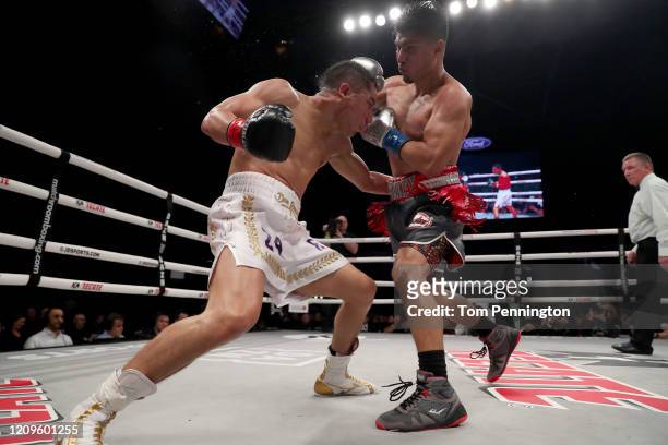 Mikey Garcia punches Jessie Vargas in their WBC Welterweight Diamond Championship bout at The Ford Center at The Star on February 29, 2020 in Frisco,...
