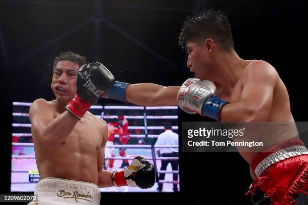 Mikey Garcia punches Jessie Vargas in the 12th round of their WBC Welterweight Diamond Championship bout at The Ford Center at The Star on February...